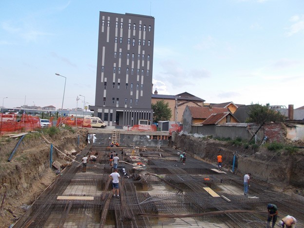 The first of three Apartment Lotus buildings is already up; the below-grade framework for the next one is being prepared for the PENETRON ADMIX-treated concrete pour.