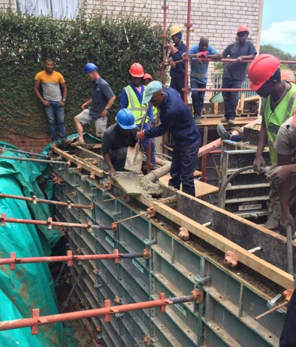 The outer retaining wall of the new eDeaf Training Center in Durban (KwaZulu-Natal) gets the PENETRON ADMIX treatment to ensure no groundwater gets through.